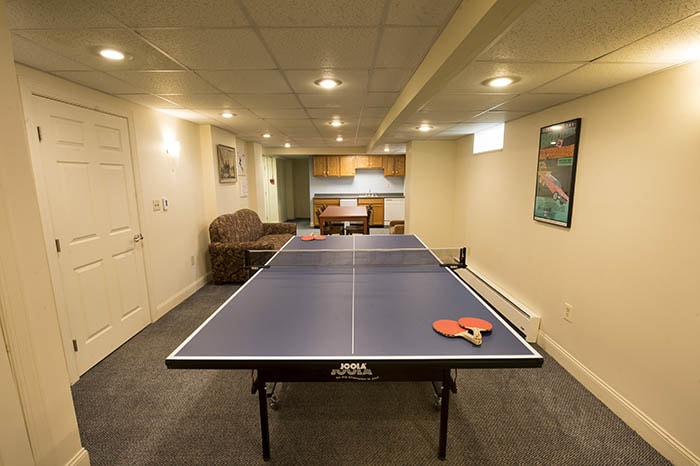 Shady Oak Apartments Game Room with Kitchenette - ping pong table couch table and kitchenette